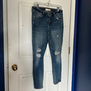 Medium wash distressed skinny jeans
